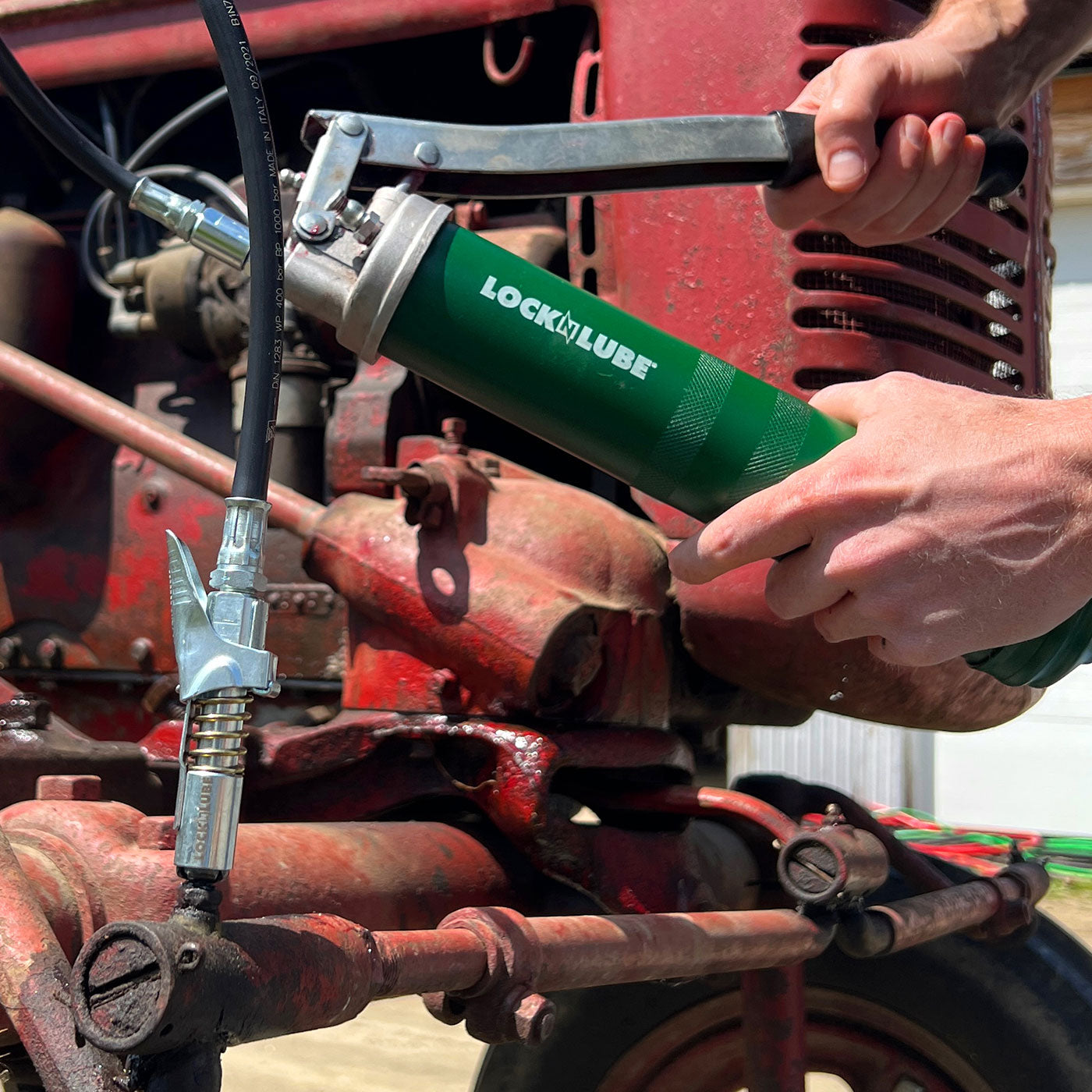 LockNLube New Zealand Grease Coupler used over Grease gun real functional image
